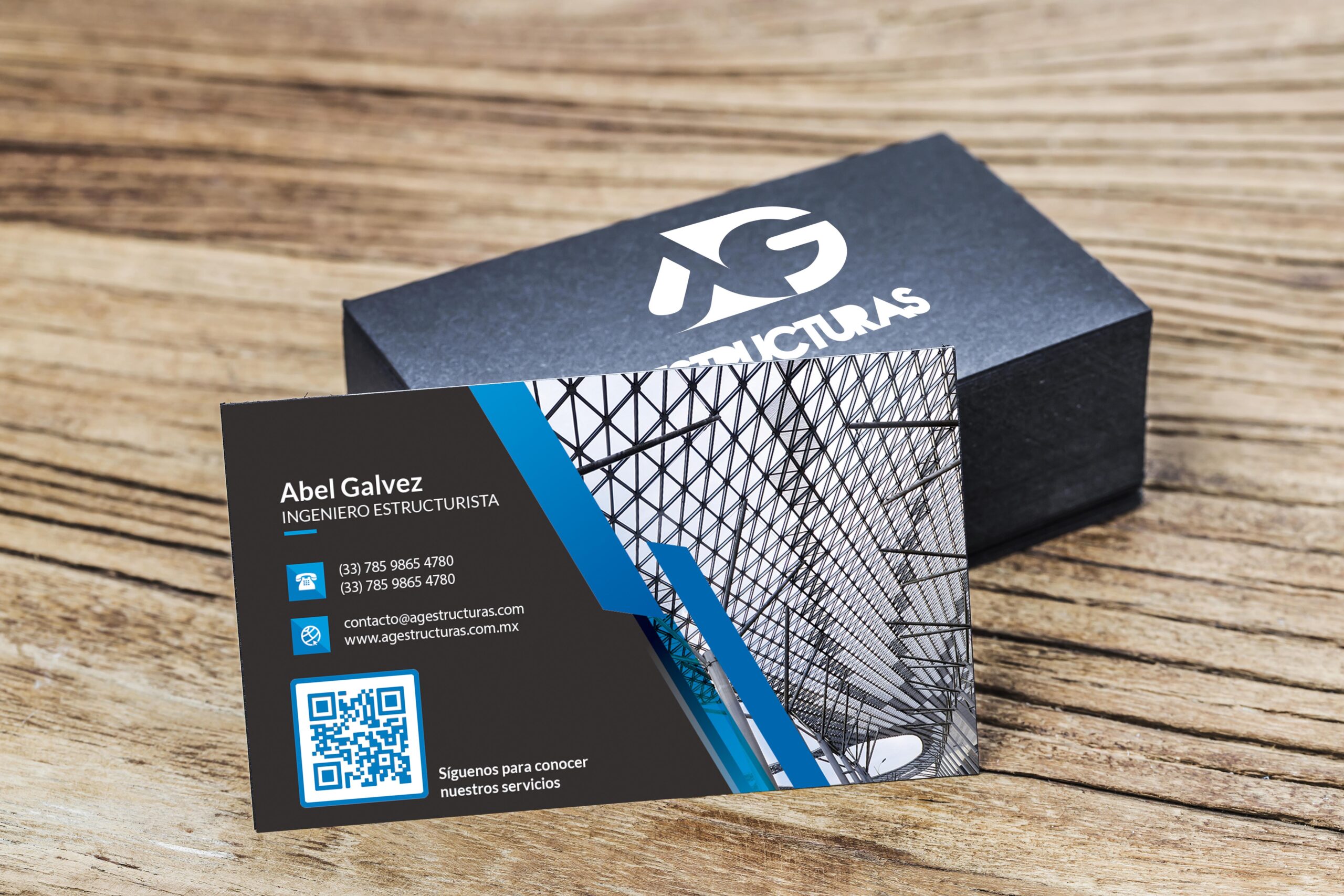 Stack of blank black business cards on wooden background